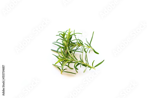 Fresh branches with leaves of organic rosemary isolated on a white background with a blur effect 