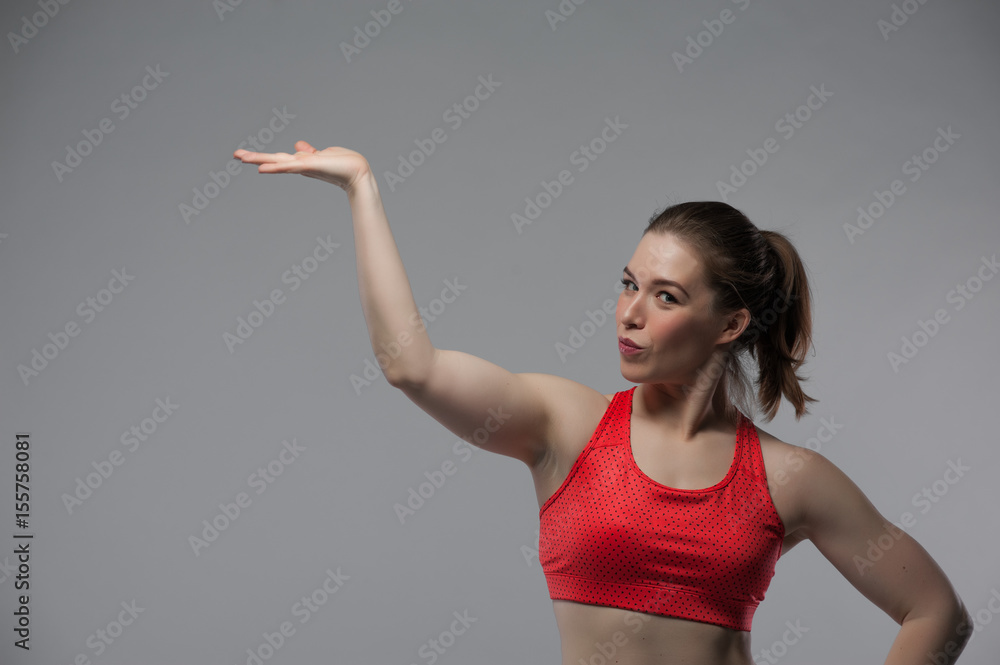 Happy smiling fitness woman posing on white Happy smiling fitness woman posing on white