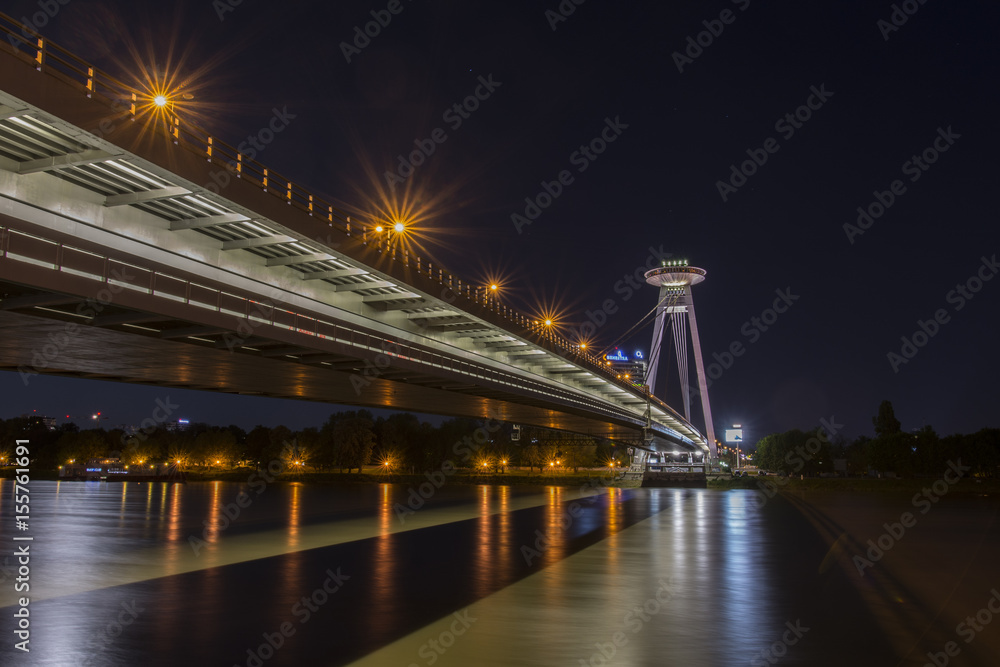 Fototapeta premium The panoramic view of UFO tower on the Danube bridge in Bratislava by night