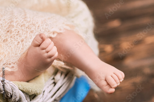 Baby feet close up. Legs of an infant. First year of life.