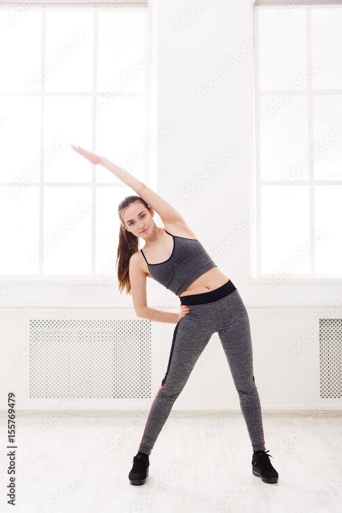 Fitness woman at stretching training indoors Fitness woman at stretching training indoors