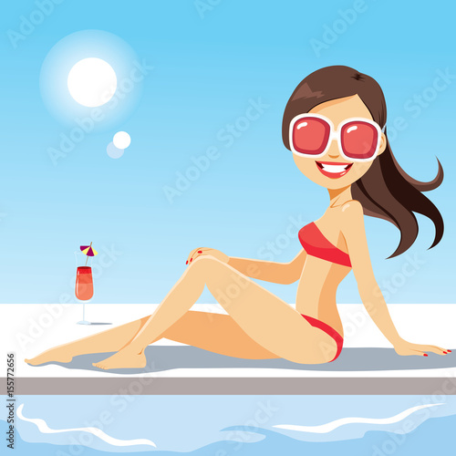Beautiful young woman lying on swimming pool with cocktail drink