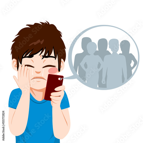 Young teenager boy suffering cyber bullying from anonymous people on-line on smartphone