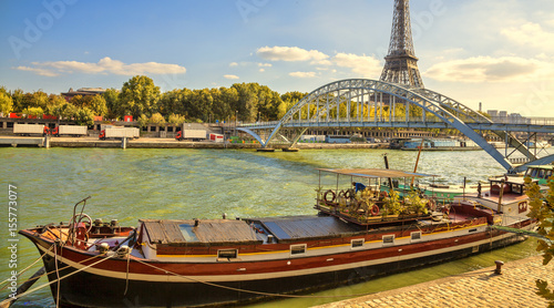 Houseboat in Paris. Houseboat on the Seine river. Eiffel tower.