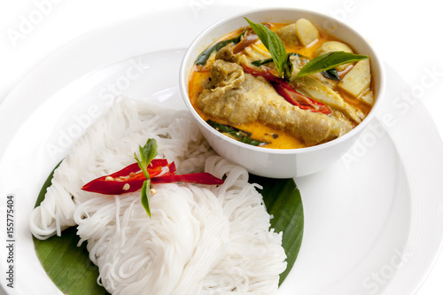 Thai vermicelli served with thai hot and spicy chicken wings curry