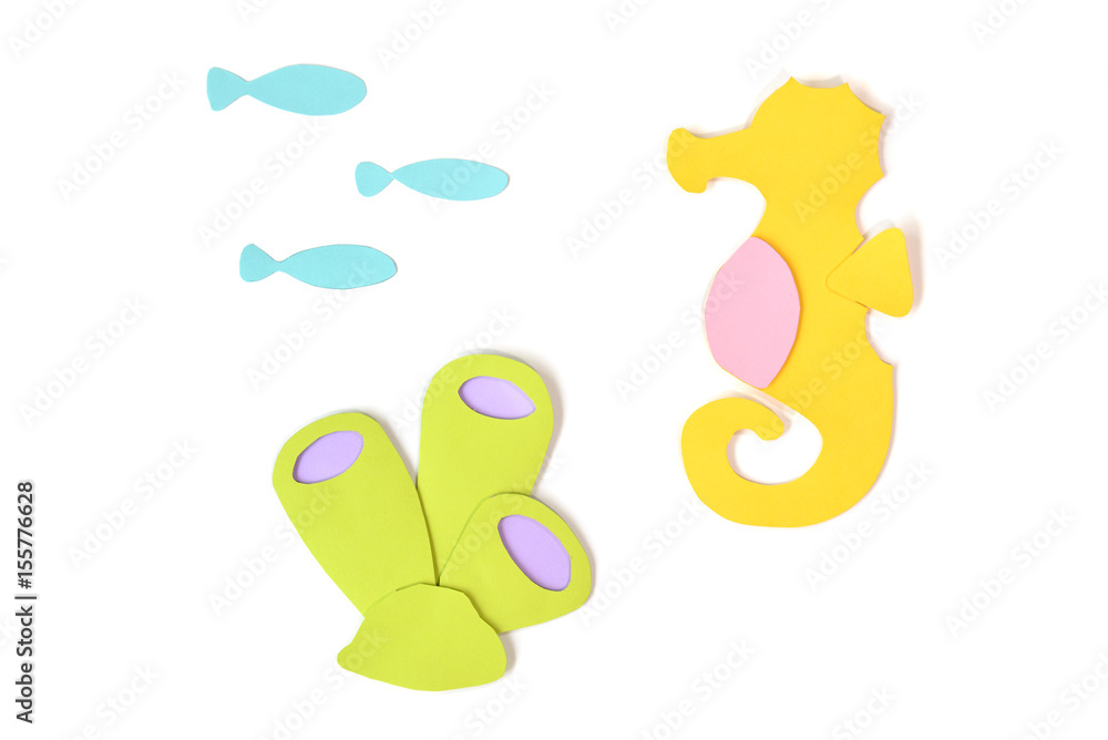 Seahorse, fish and sea sponge paper cut on white background - isolated