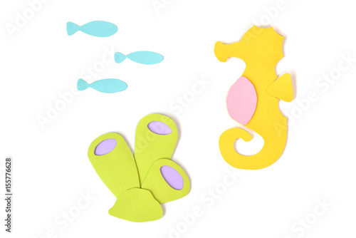 Seahorse, fish and sea sponge paper cut on white background - isolated