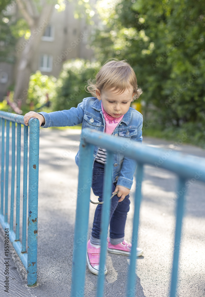 A little girl in the play park A little girl in the play park