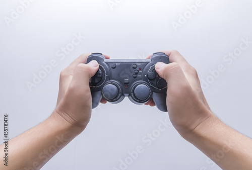 Hand with gamepad isoated on white background