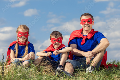 Father and children playing superhero at the day time. © altanaka
