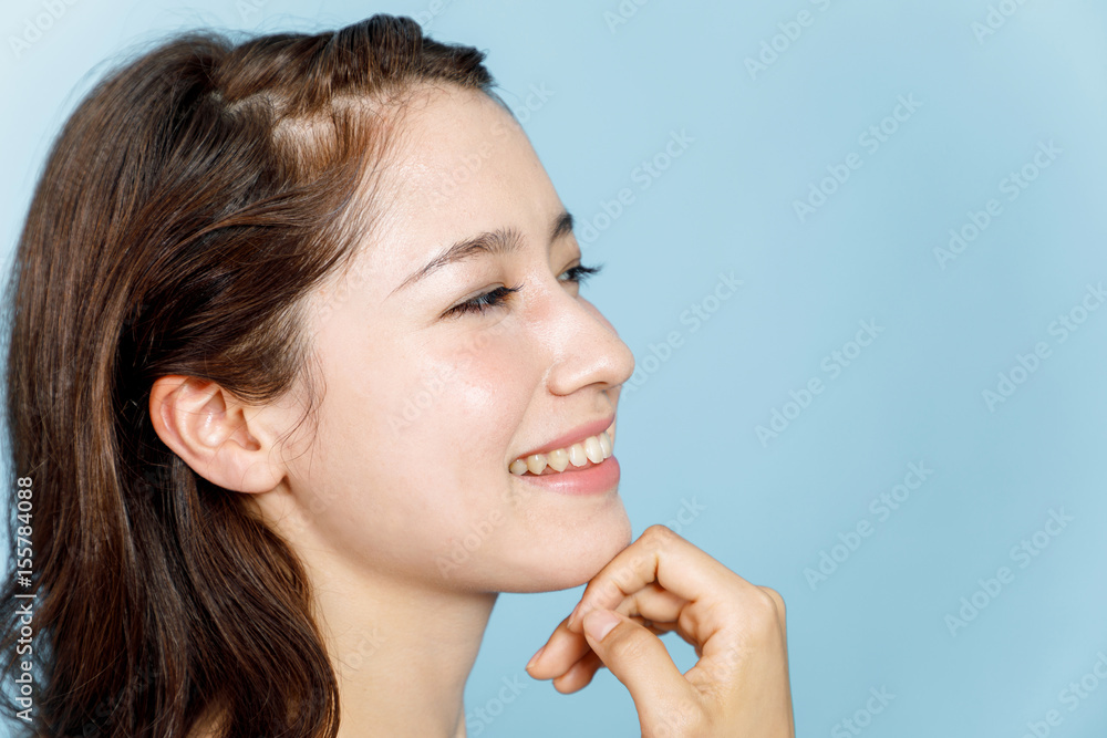 young woman who checks her skin. skincare concept. young woman who checks her skin. skincare concept.
