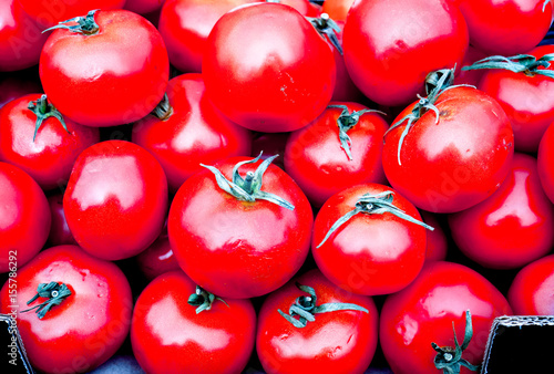 A lot of fresh red tomato together photo