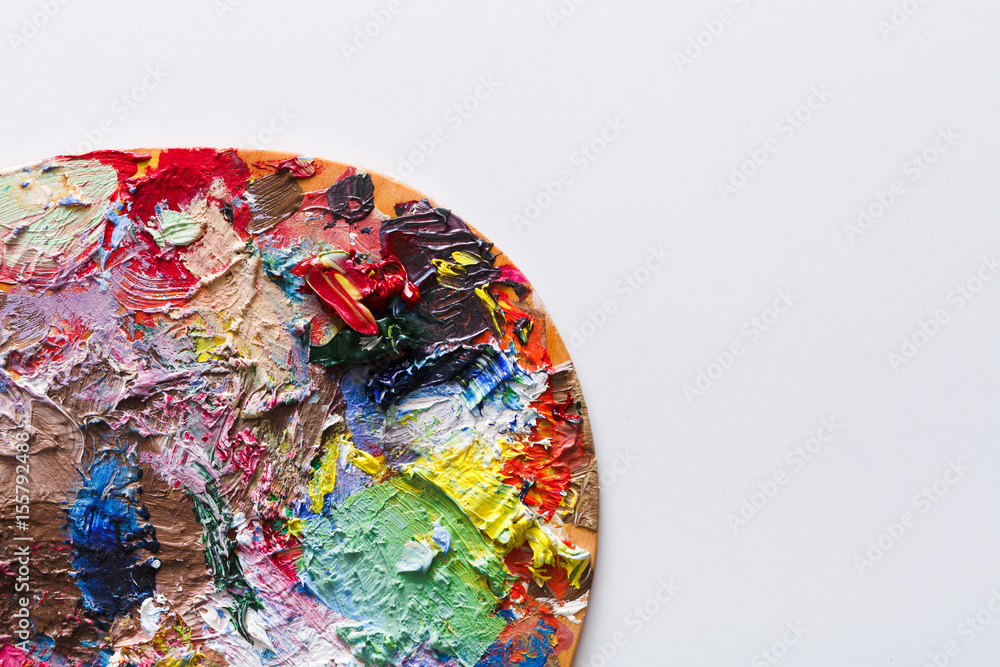 Art palette closeup with colorful paint strokes, isolated