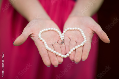  Heart of a Pearl Necklace on the Hands