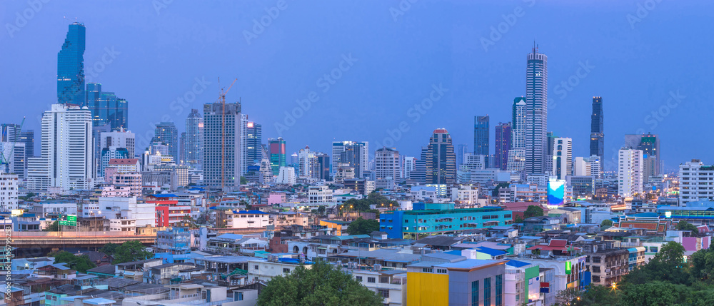 The beautiful scenery panorama of tall buildings in the capital after sunset. City growth is being compared between residential and business districts.