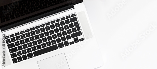 Top view of silver laptop showing keyboard with wide text space 