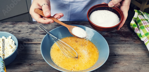 Cooking food. The woman the cook prepares the dough or cream. Bakery products. Rustic style. photo