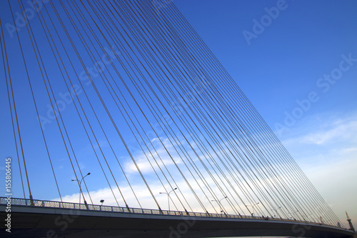 Fototapeta Naklejka Na Ścianę i Meble -  A rope bridge and blue sky