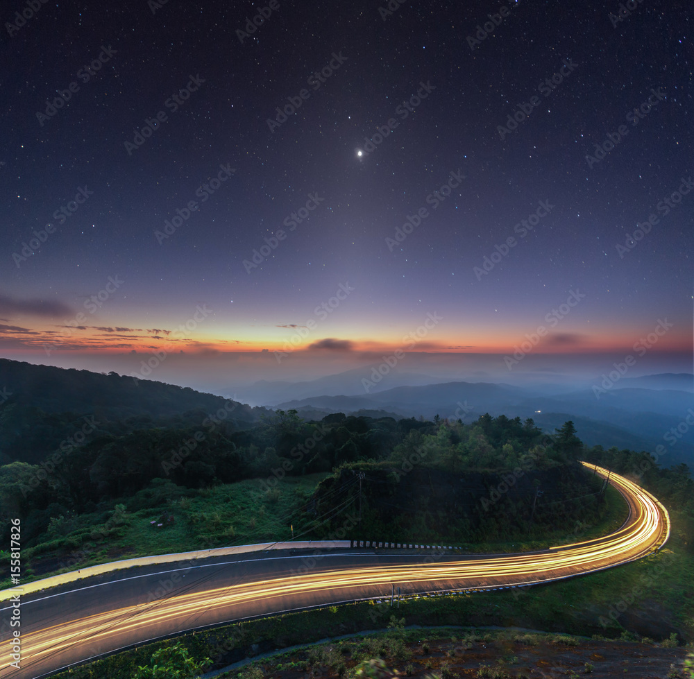 Obraz premium nature sunrise background amazing curve road and zodiacal light star night sky twilight color long exposure view. Popular travel Mountain Doi Inthanon Road km41 Chiang Mai province in Thailand