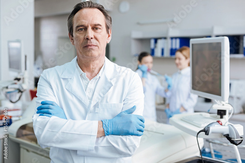 Photos Serious male person crossing arms on chest