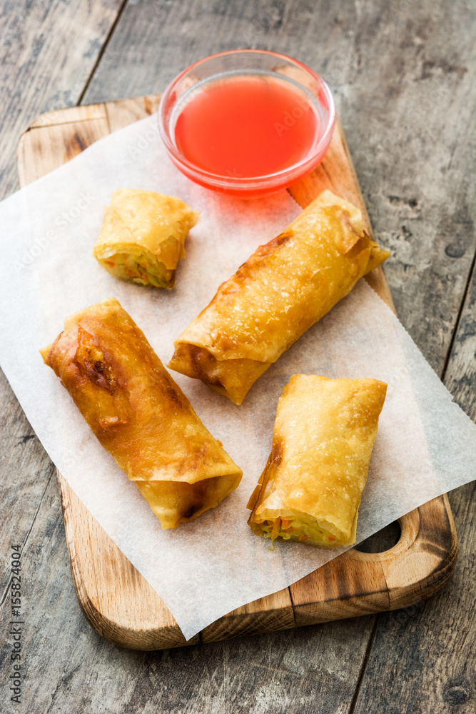 Vegetable spring rolls on wooden table background
Vegetable spring rolls on wooden table background