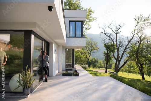 woman in front of her luxury home villa © .shock