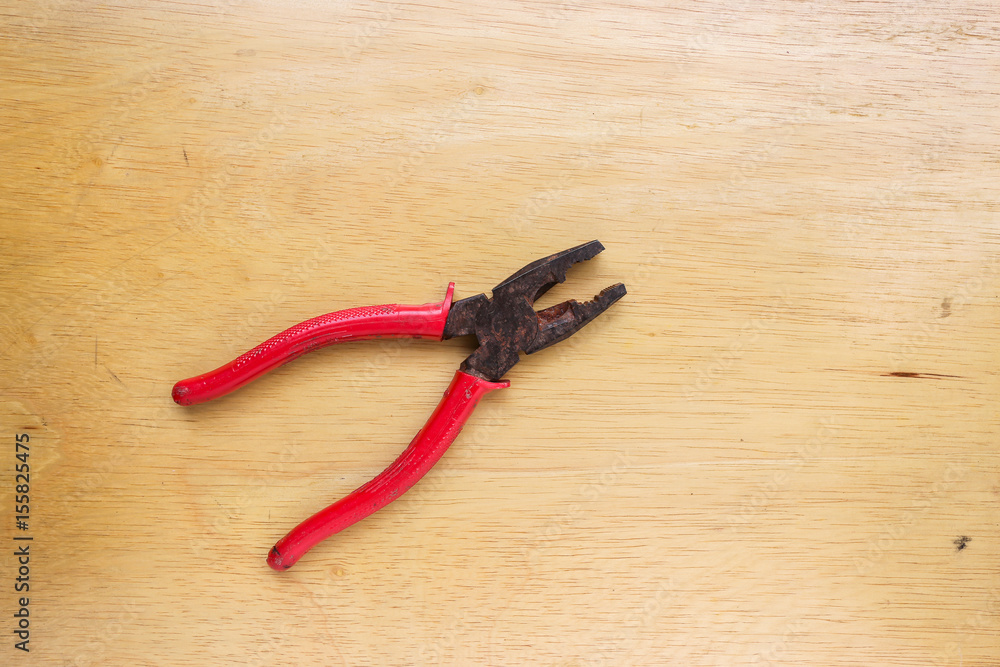 work tools wrench, pliers hand, pliers old,on a wooden table work tools wrench, pliers hand, pliers old,on a wooden table
