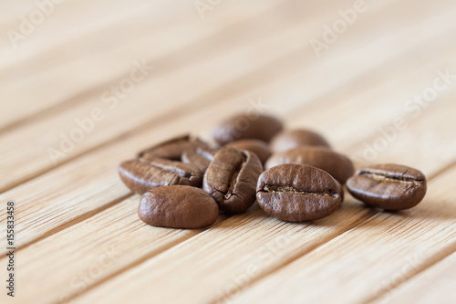 Coffee beans on wooden table cloth, decorative wallpaper
