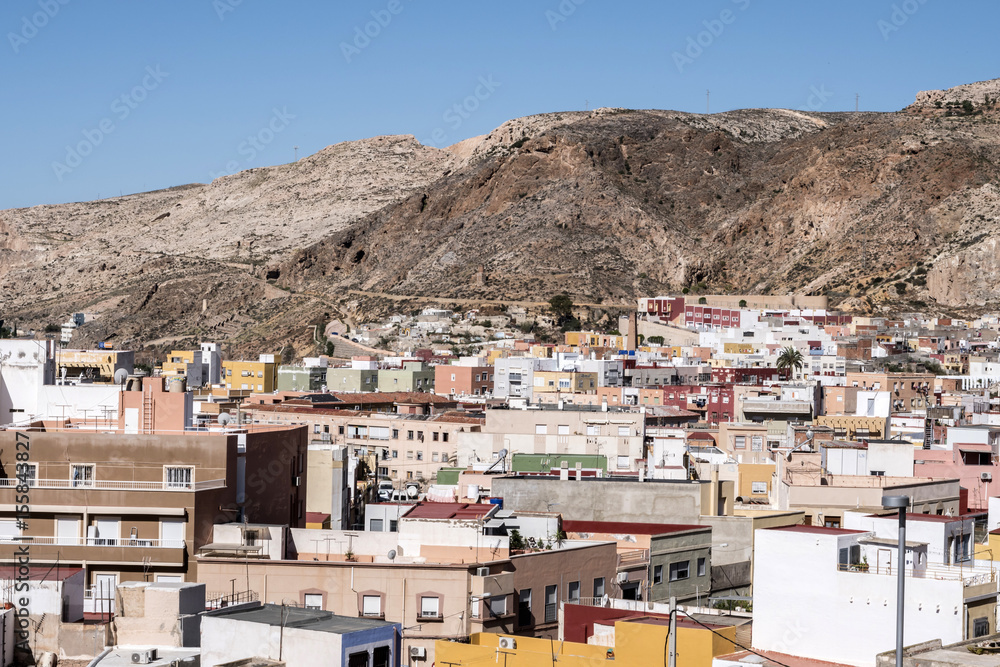 View from the fortress of Moorish houses and buildings along the port of Almeria, Andalusia, Spain