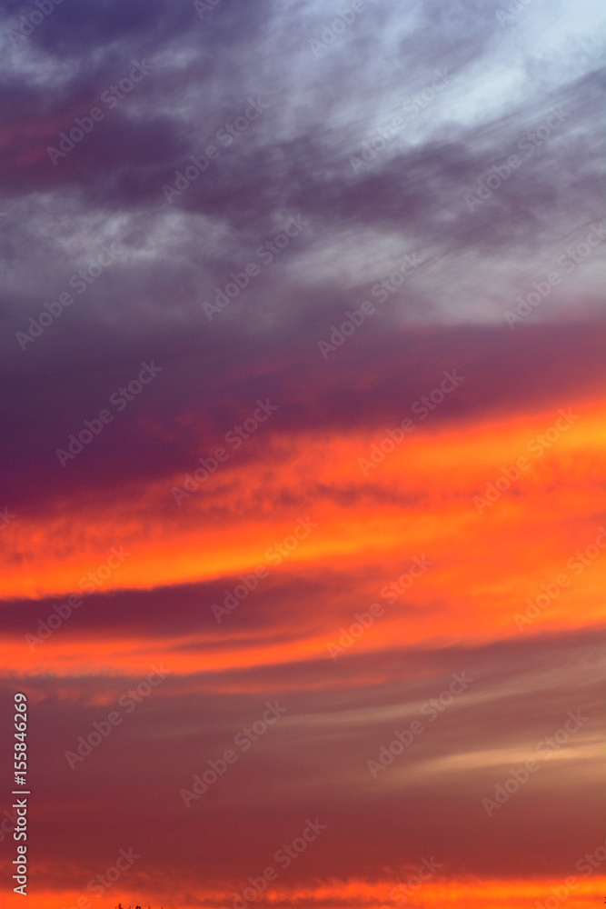 Dramatic sky at sunset with red, yellow and orange colors.