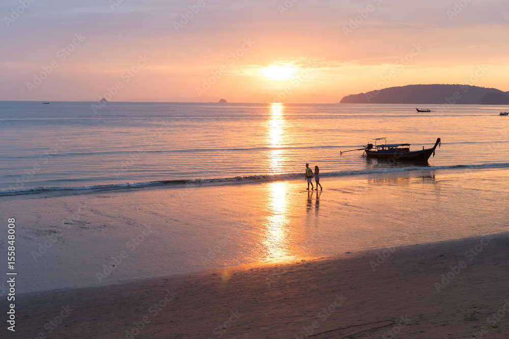 Couple Walking Holding Hands On Beach At Sunset In Thailand, Young Tourist Man And Woman On Sea Holiday While Asia Summer Vacation