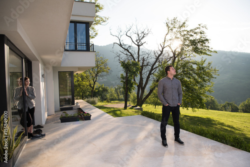 man in front of his luxury home villa © .shock