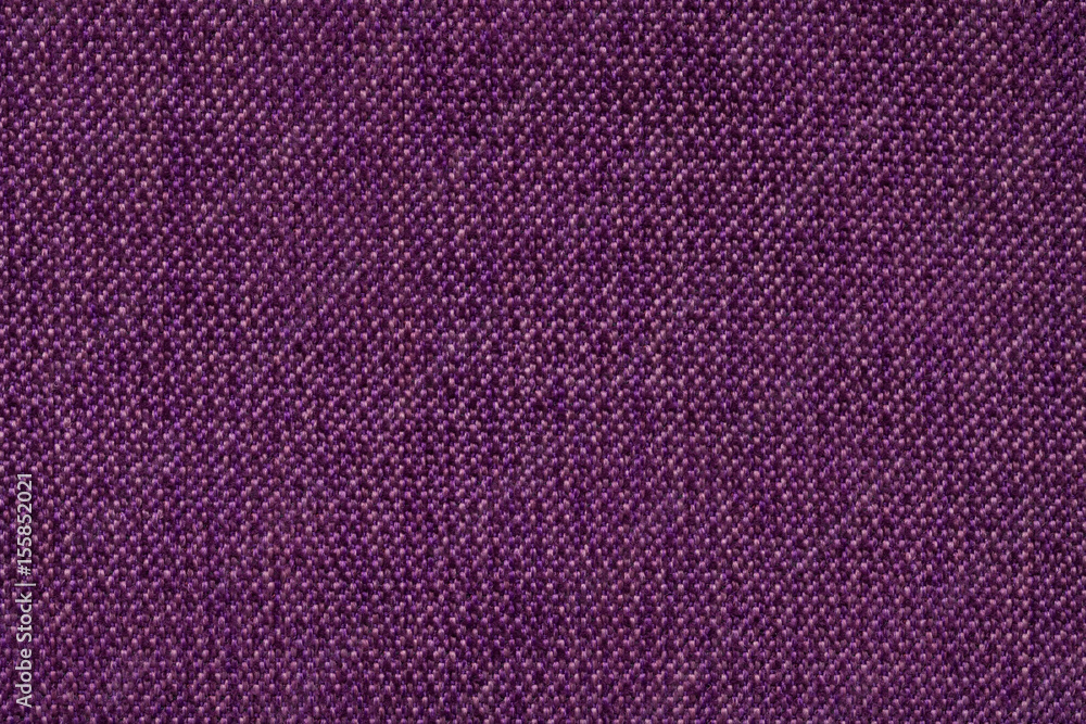 Dark purple background from woolen texture textile, closeup. Structure of the wicker fabric macro.