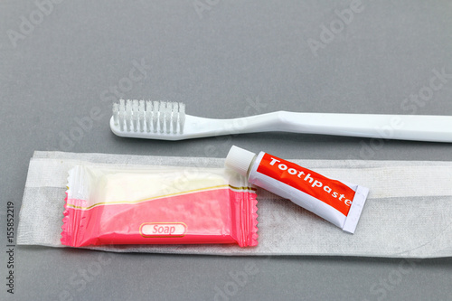 Hotel amenities kit on gray background