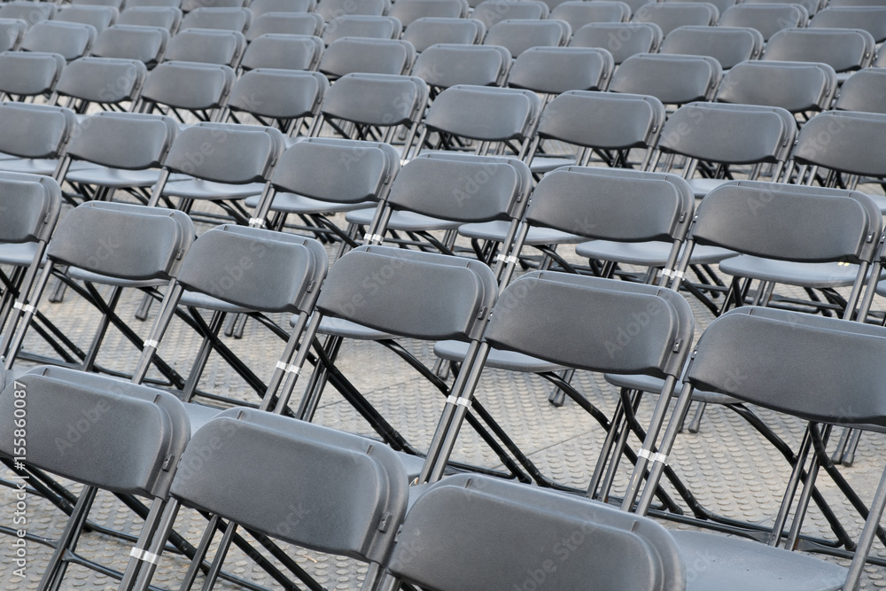 many empty seats - black folding chairs many empty seats - black folding chairs