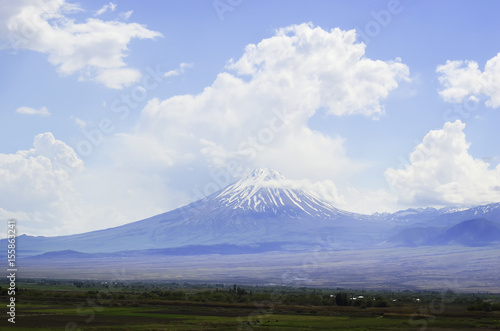 The peak of a famous mountain Ararat in a cloudy winter day. Clouds are over and beneath the peak
