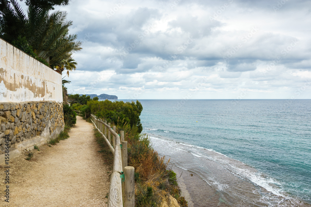 Landscape of the coast of Calpe, Spain with a natural path