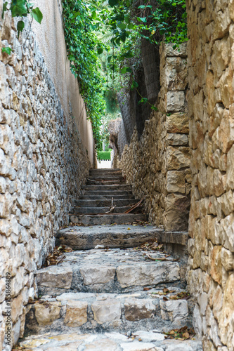 Fototapeta Naklejka Na Ścianę i Meble -  Narrow stairs on a rural town