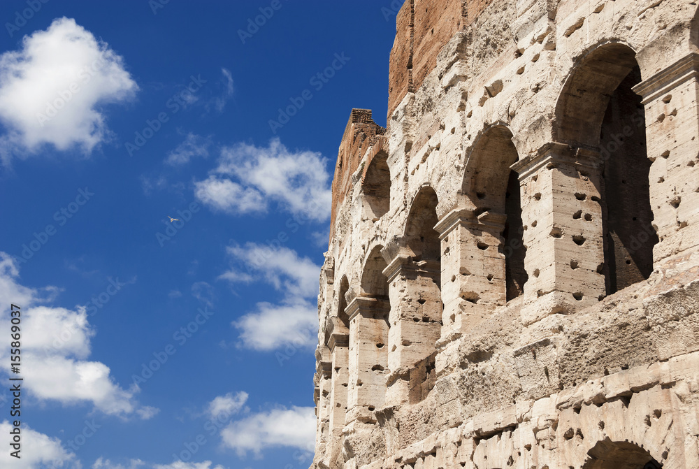 Coliseum monumental arches with blu sky in Rome