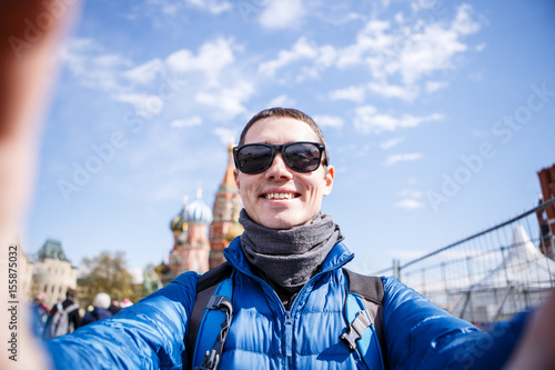Cheerful man making selfie