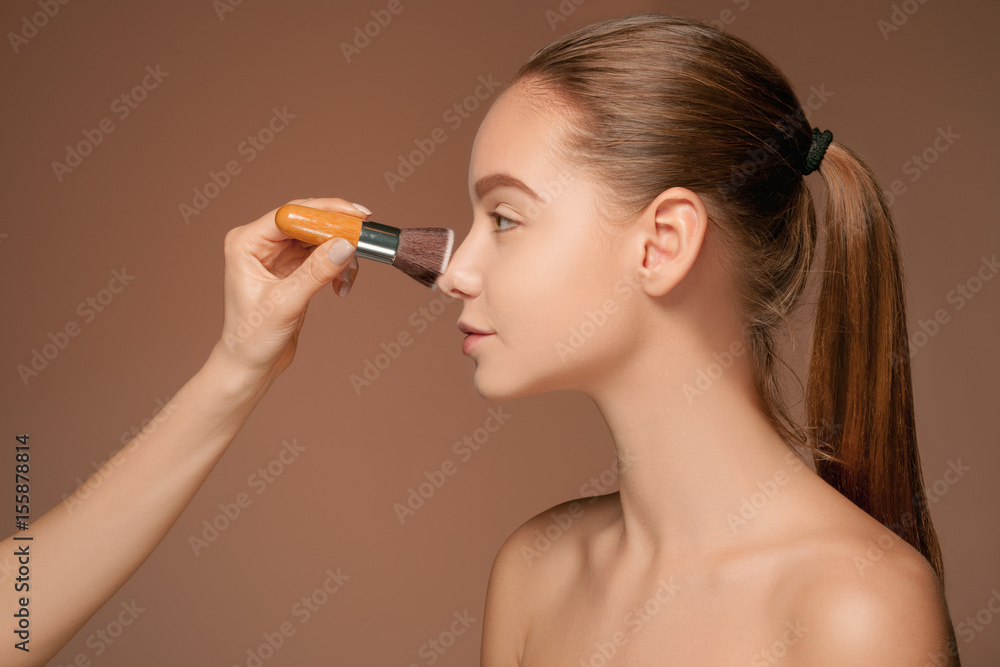 Obraz premium Beautiful female eyes with make-up and brush