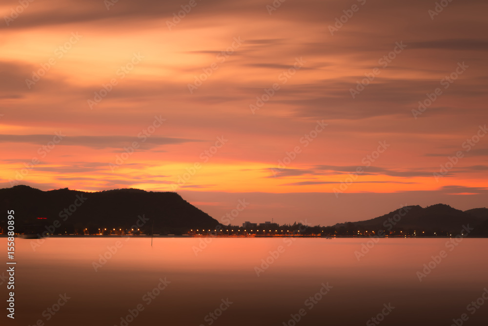 Dramatic coastline sunset with mountain range twilight time : Seascape