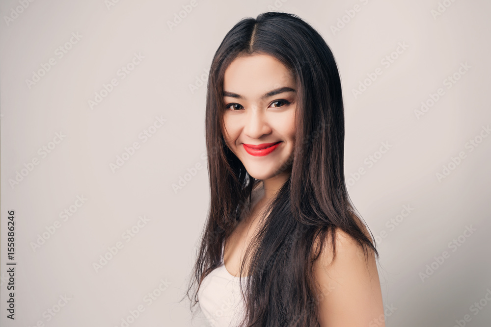 Young beautiful Asian woman with smiley face. Young beautiful Asian woman with smiley face.