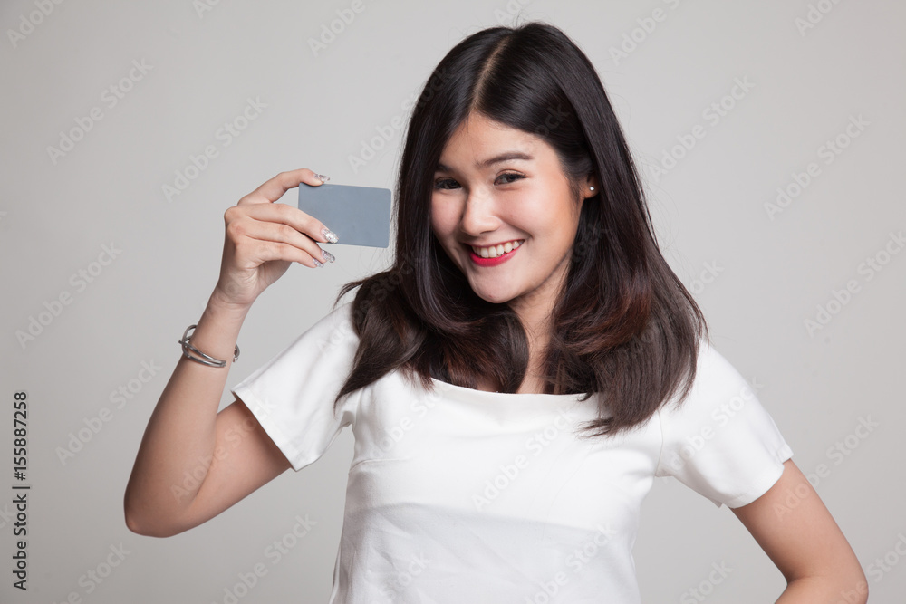 Young Asian woman smile with blank card. Young Asian woman smile with blank card.
