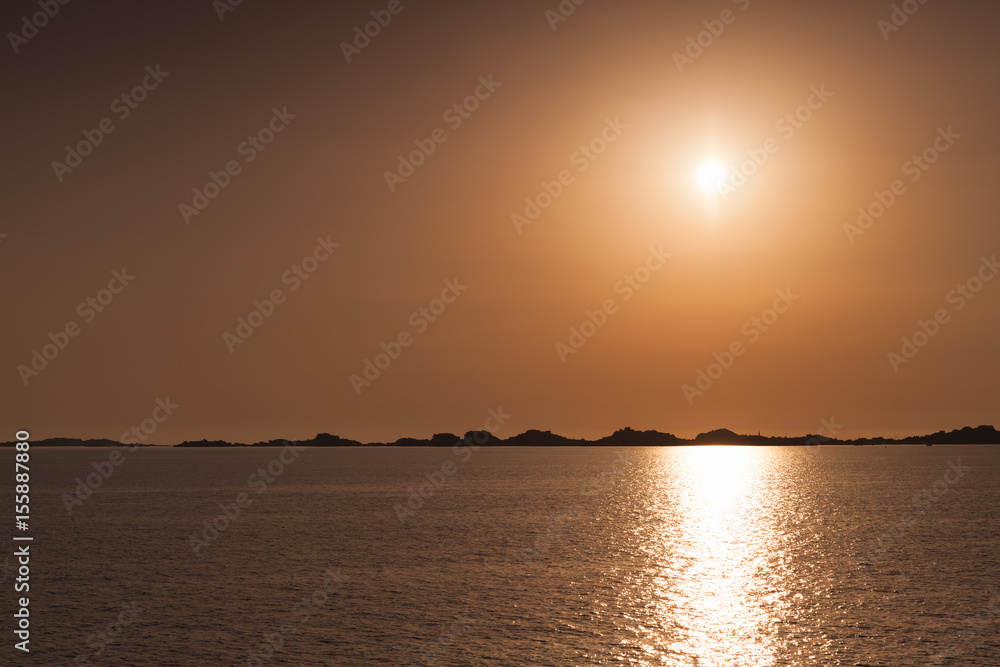 Rising sun over horizon of Bonifacio, Corsica
