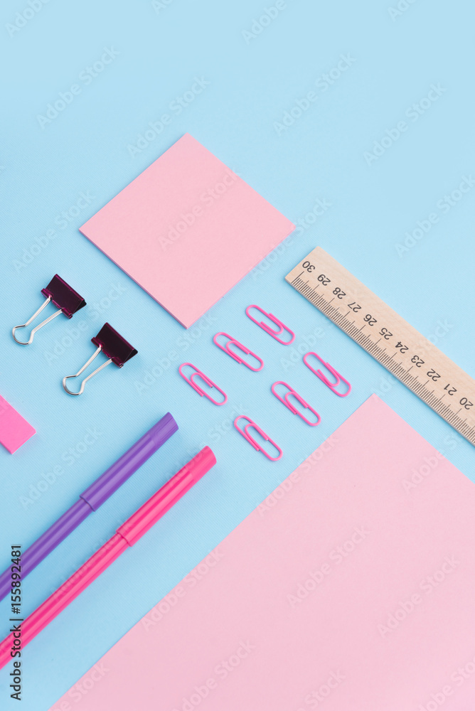 Office supplies on the blue background table Office supplies on the blue background table