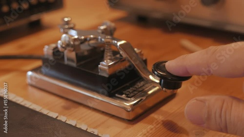 Morse code transmitter being used, communication old style