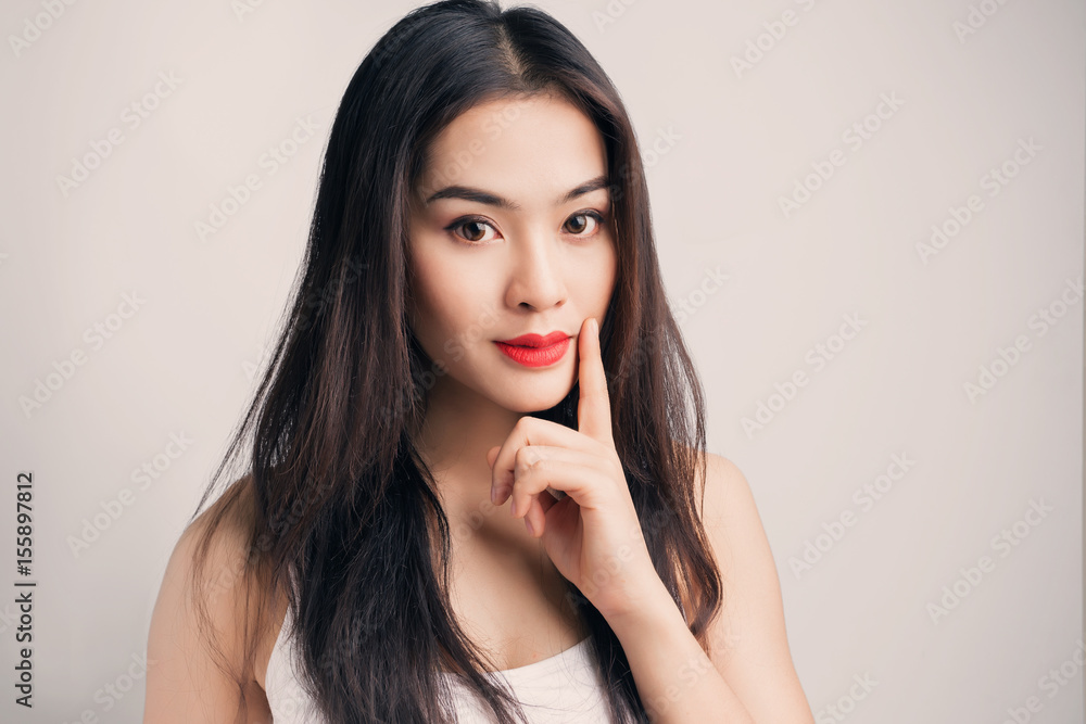 Young Asian woman with doubtful emotion. Young Asian woman with doubtful emotion.