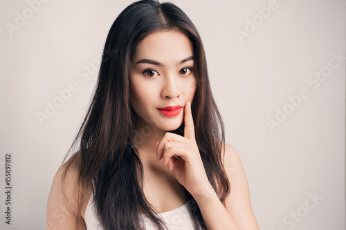 Young Asian woman with doubtful emotion.