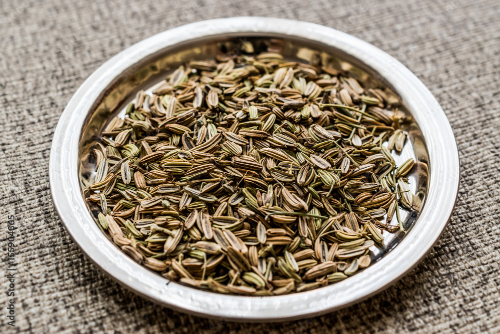 Fennel Seeds on silver plate.